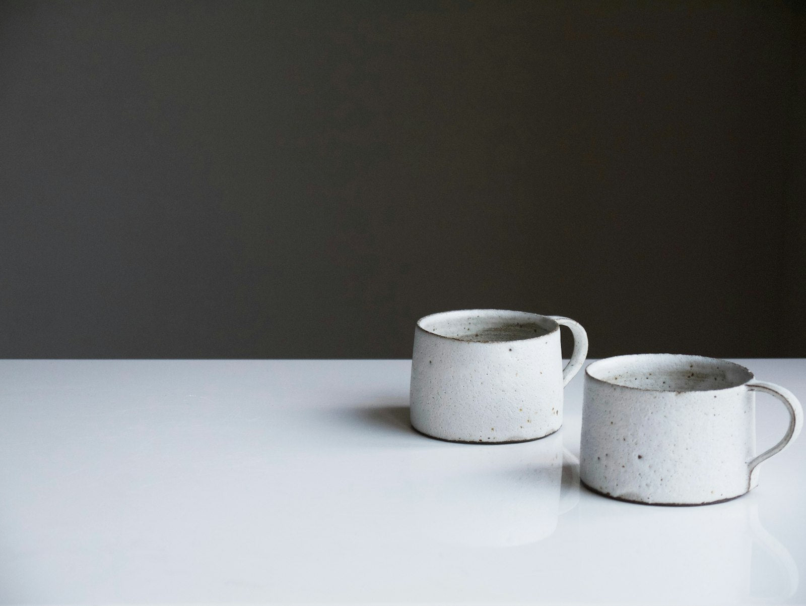 Two white ceramic mugs