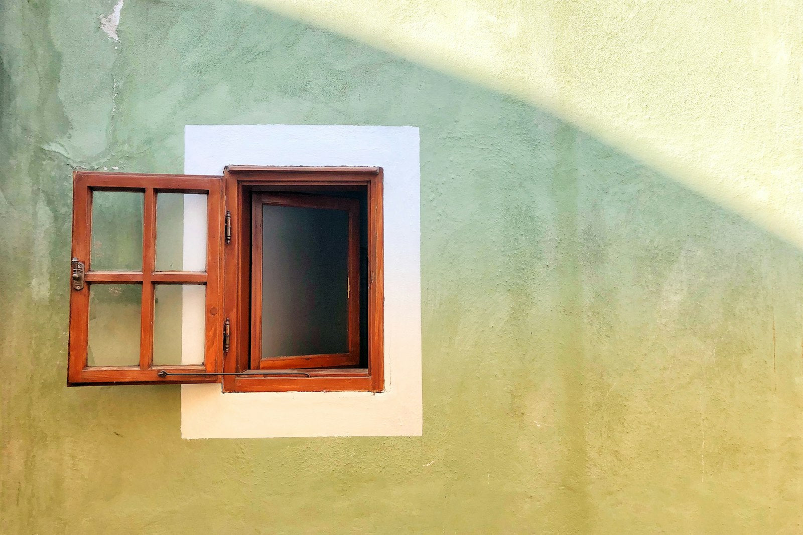 Opened brown wooden window
