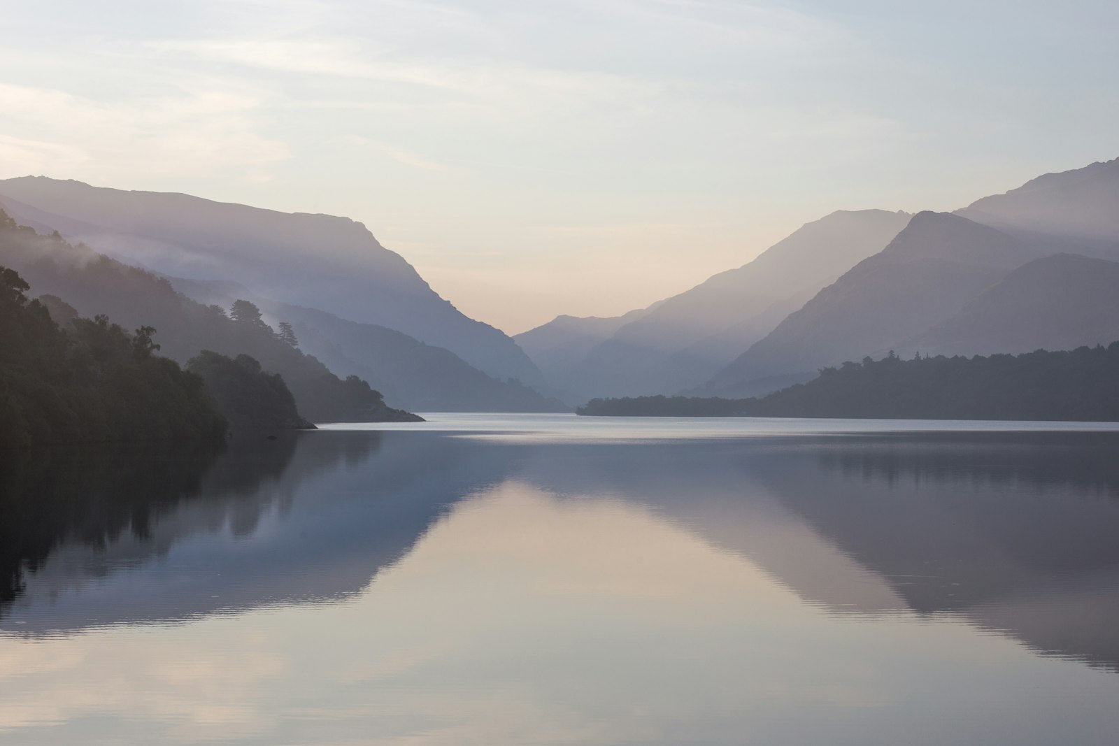Mountain near body of water during daytime